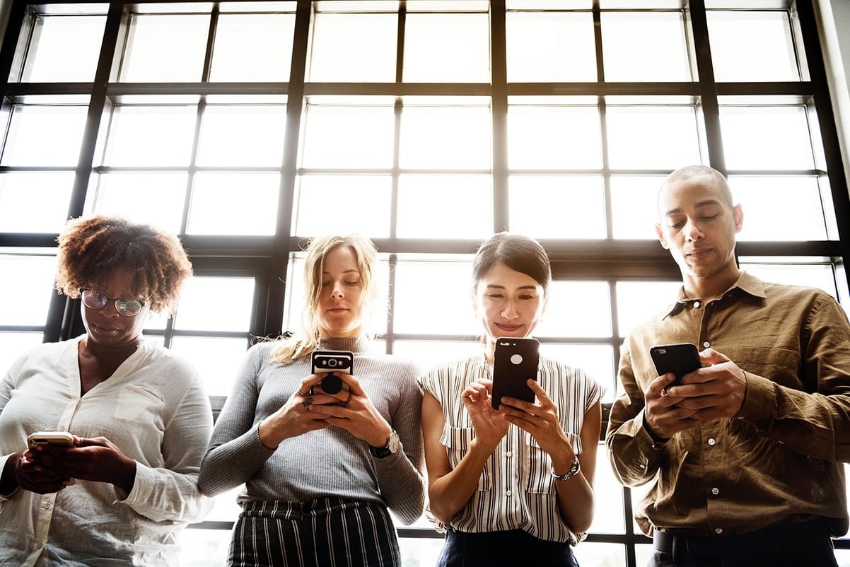 A group of people using an app on a smartphone